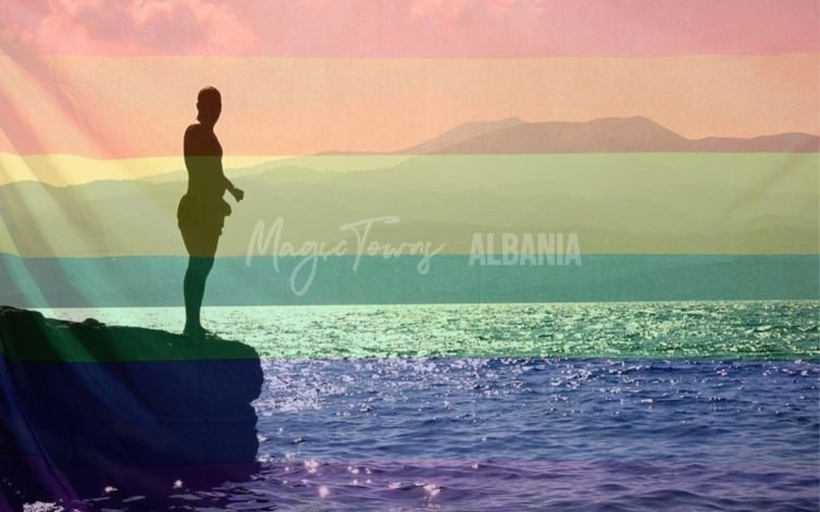 person standing near a cliff with an ocean in the background